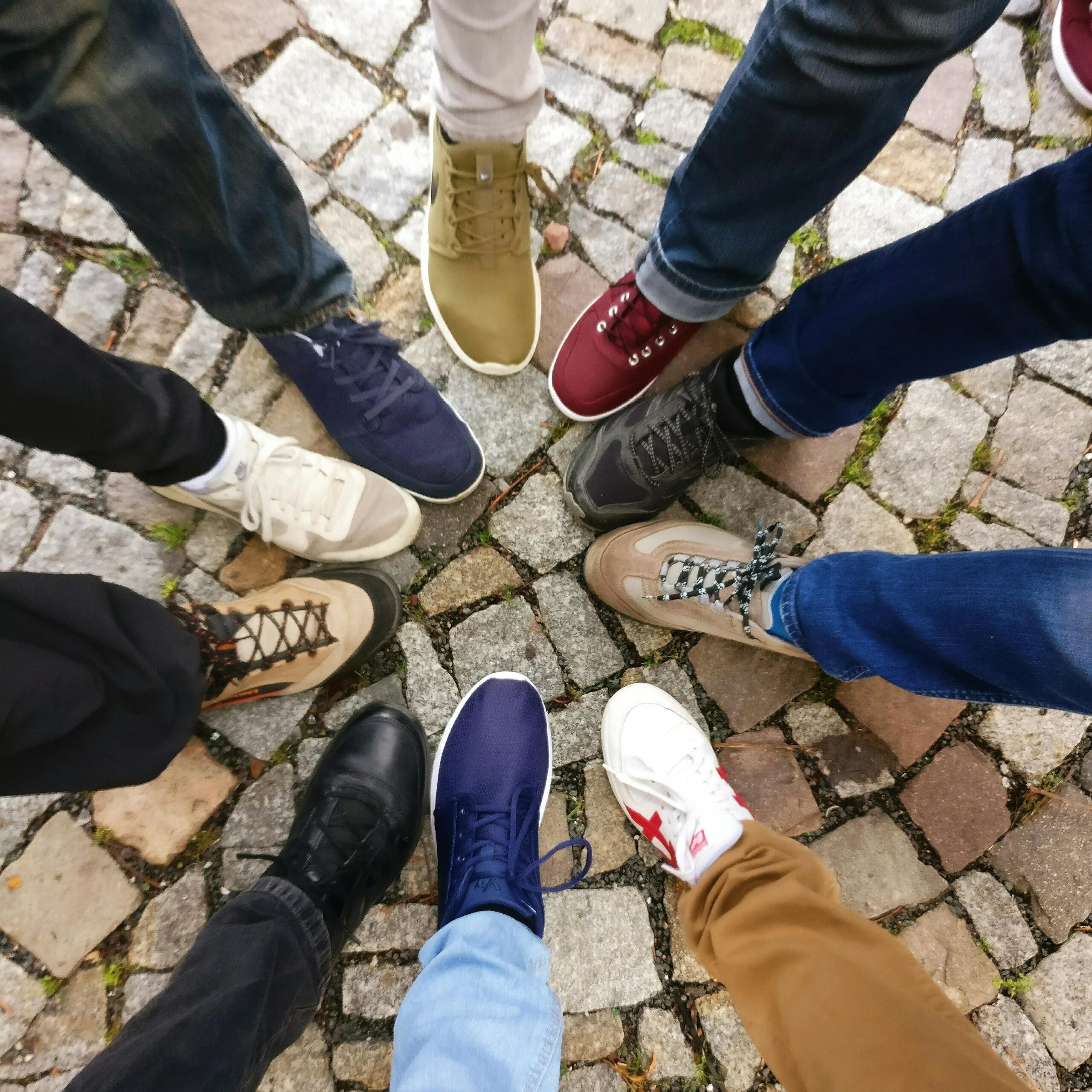 A circle of shoes put together, all different colours